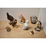 A group of Royal Doulton for Whyte & Mackay,and Beswick spirit decanters, Osprey decanter and Grouse