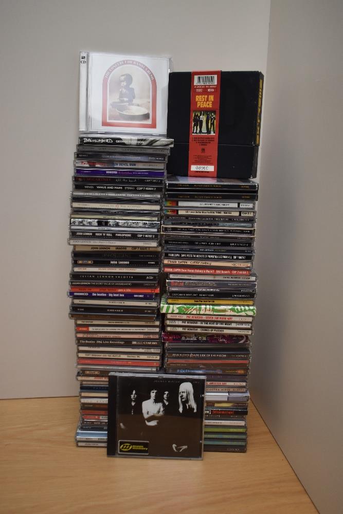 A large box of compact discs as in photos - some decent potential here for resale - rock , pop -