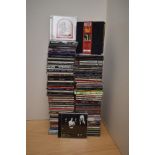 A large box of compact discs as in photos - some decent potential here for resale - rock , pop -