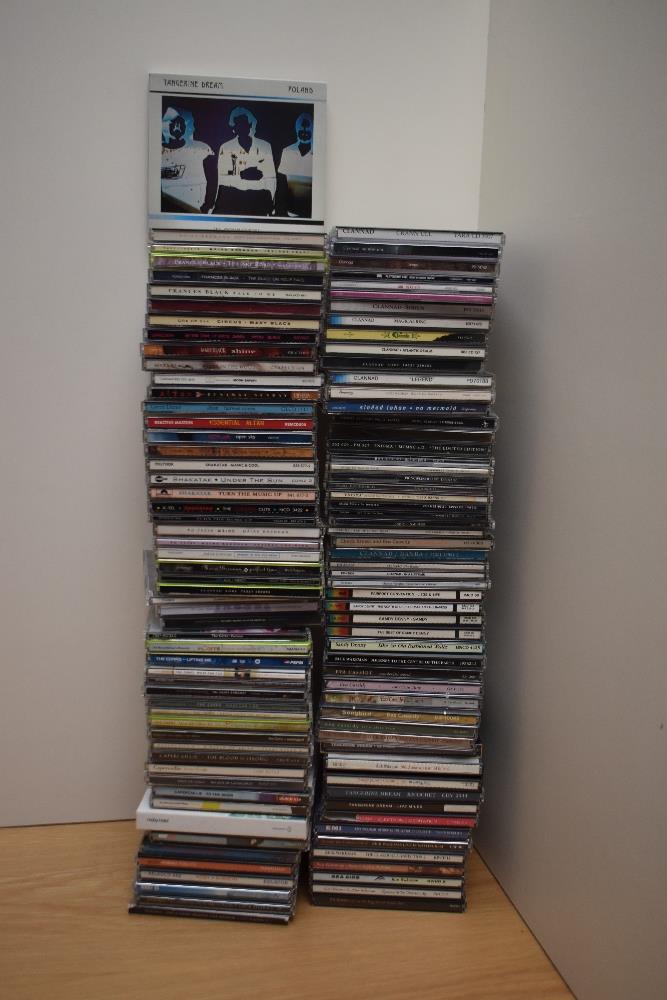 A large box of compact discs as in photos - some decent potential here for resale - rock , pop and