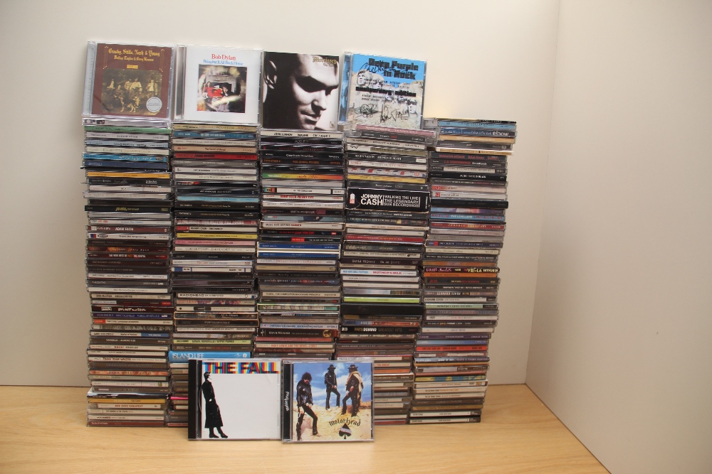 A large selection of compact discs as per photos with good resale potential - rock , pop , indie and