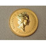 An Australian 1990 Nugget 5 Dollar Coin, 1/20th Ounce .9999 Gold, 1.5g, in plastic slab