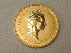 An Australian 1990 Nugget 5 Dollar Coin, 1/20th Ounce .9999 Gold, 1.5g, in plastic slab