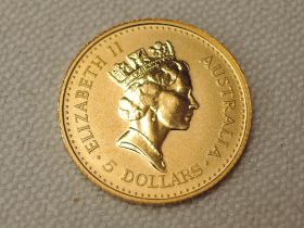 An Australian 1990 Nugget 5 Dollar Coin, 1/20th Ounce .9999 Gold, 1.5g, in plastic slab