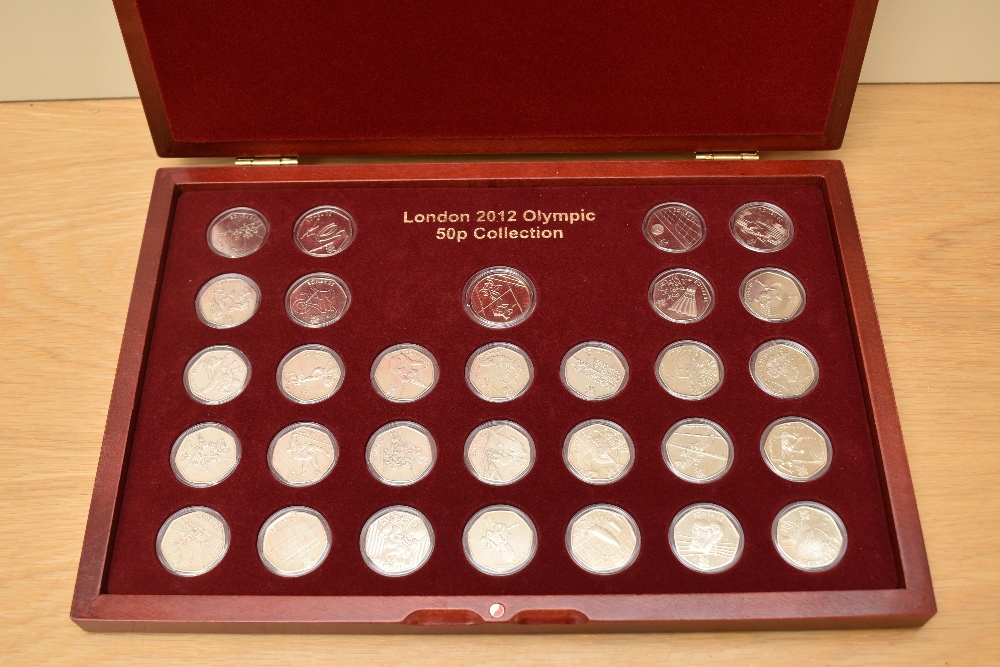 A Queen Elizabeth II United Kingdom London 2012 Olympic Commemorative Fifty Pence Collection