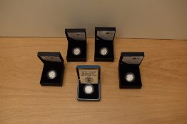 Five Royal Mint Silver Proof One Pound Coins, 1985, 2010 London, 2010 Belfast, 2011 Cardiff 2011