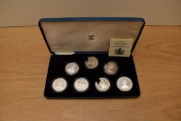 A cased set of 7 1980 Queen Mother 80th Birthday Silver Proof Commemorative Crowns including