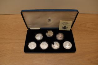 A cased set of 7 1980 Queen Mother 80th Birthday Silver Proof Commemorative Crowns including