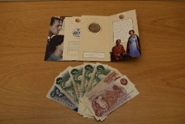 A Royal Mint Golden Wedding 1997 Five Pounds in folding wallet and slip case, Ten Shillings x2,