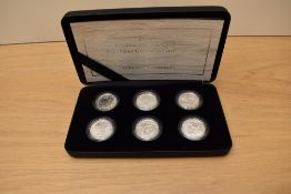 A Royal Mint 2007 Britannia 20th Anniversary, Silver Proof One Pound Collection with certificates in
