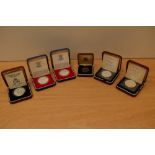 Five Silver Proof Crowns in cases with certificates, GB Silver Jubilee 1977 x2, St Helena