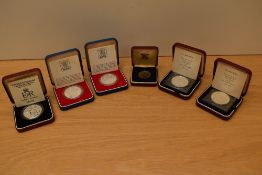 Five Silver Proof Crowns in cases with certificates, GB Silver Jubilee 1977 x2, St Helena