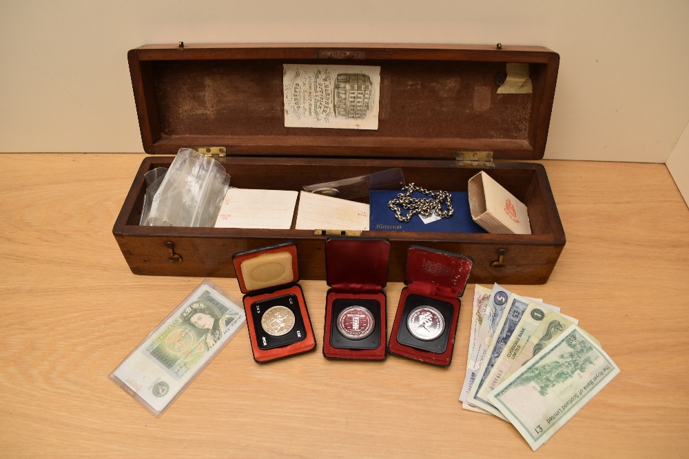 A collection of GB & World Coins including four Canadian Silver Dollars, three cased,1.5 oz of World
