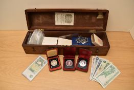 A collection of GB & World Coins including four Canadian Silver Dollars, three cased,1.5 oz of World