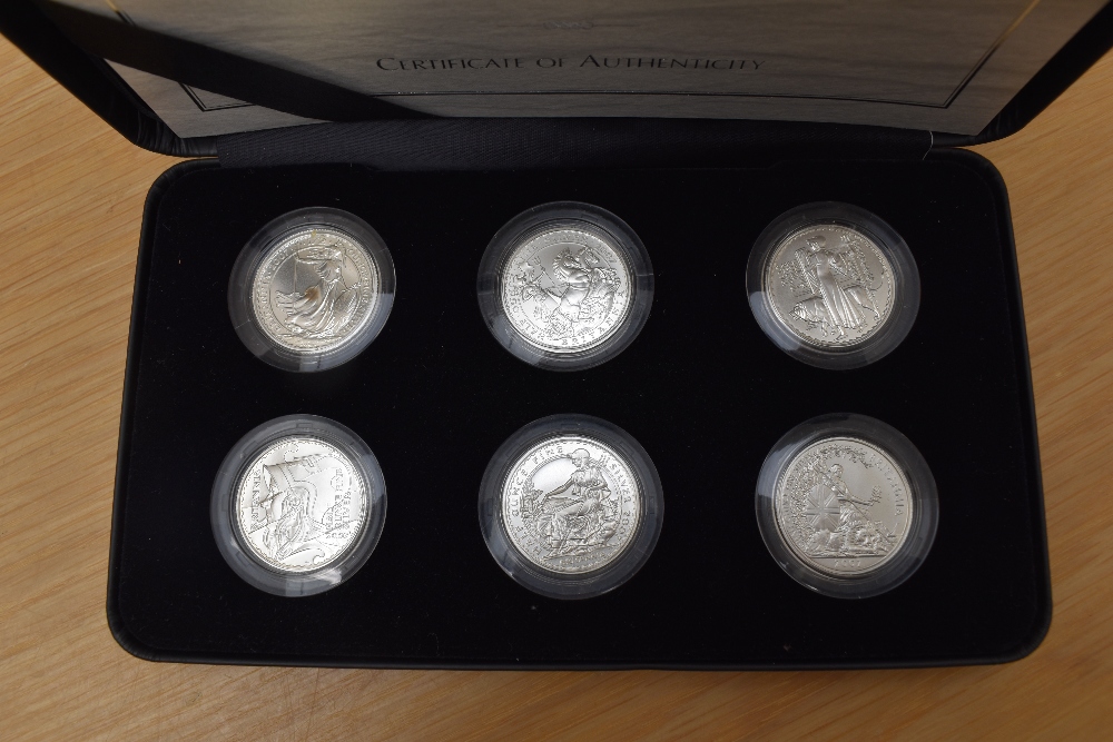A Royal Mint 2007 Britannia 20th Anniversary, Silver Proof One Pound Collection with certificates in - Image 2 of 2