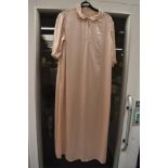 A vintage blush ivory coloured glossy satin nightdress.