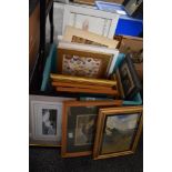 A carton of assorted pictures and prints with a variety of scenes.