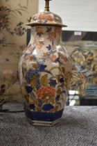 A large Oriental style table lamp AF (large chip to top collar at the back).