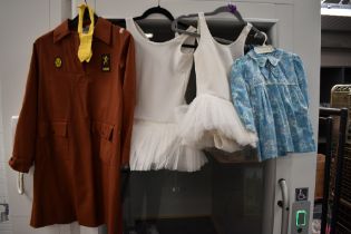 Two 1960s floral infants dresses, two tutus and a girl guides uniform.