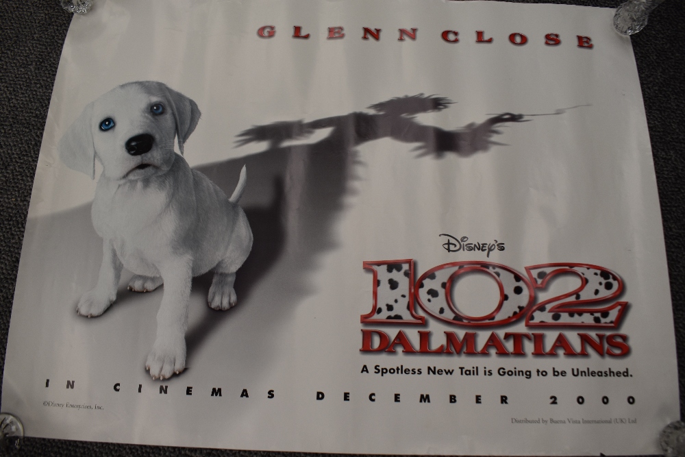 A small selection of posters including a Disney's 102 Dalmations promotional poster, three vintage