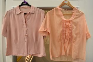 Two 1950s pink blouses, one of pink crepe with cut work and machine embroidery to collar and