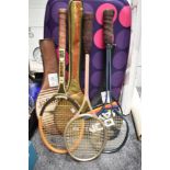 Three retro badminton rackets.