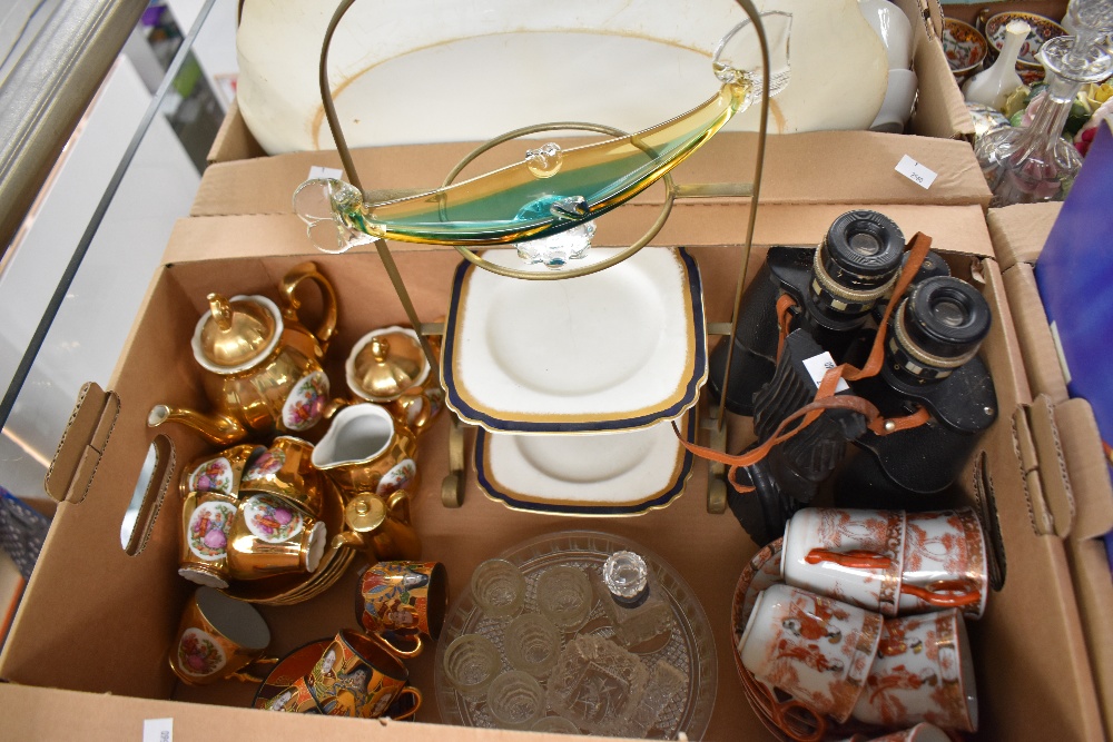 A miscellaneous selection of items including a vintage dark green and amber Murzno glass gondola,