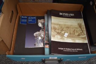 Aa carton containing a selection of vintage Bonhams sale catalogues.