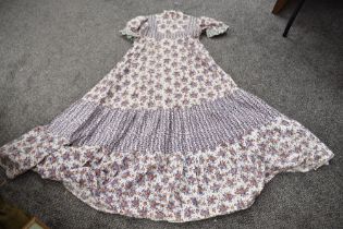 A vintage cotton 1970s tiered dress having high neck and puffed sleeves approx size 8/10.