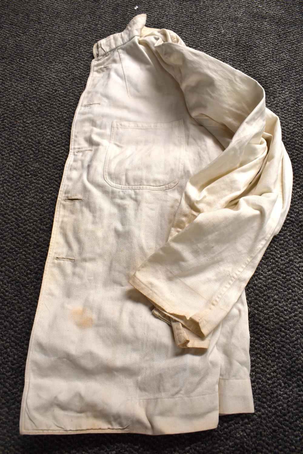 A carton of assorted clothes including mens cotton white trousers, ladies linen painting smocks, a - Image 3 of 11