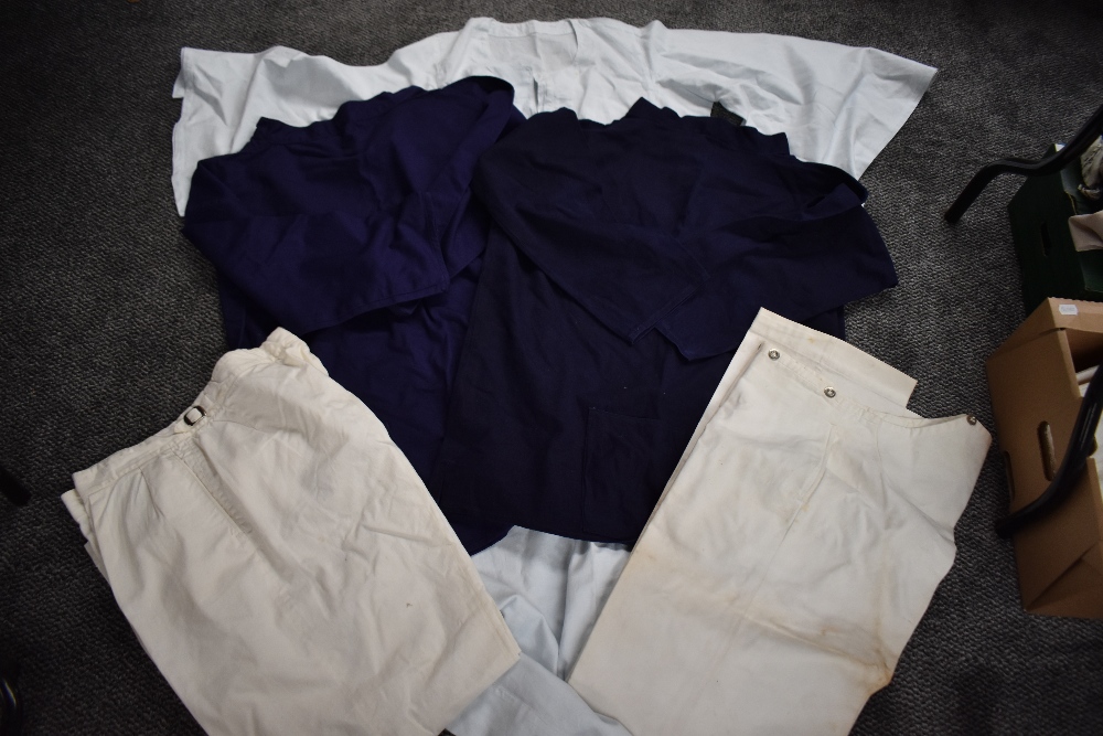 A carton of assorted clothes including mens cotton white trousers, ladies linen painting smocks, a - Image 2 of 11