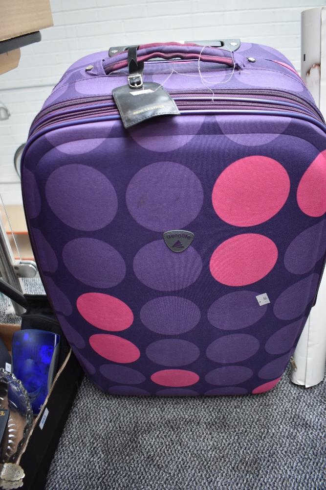 A large Aerolite suitcase with extendable handle.