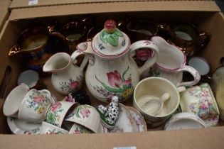 Five copper lustre ware jugs, a Luneville France part coffee service (24 pieces approx) having