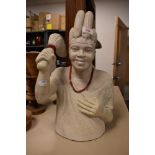 An African carved yellow granite tribal stone bust.