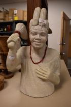 An African carved yellow granite tribal stone bust.