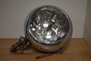 A 1930s Stephen Grebel vehicle spot lamp, having chrome handle fitted to rear, pillar mounted and