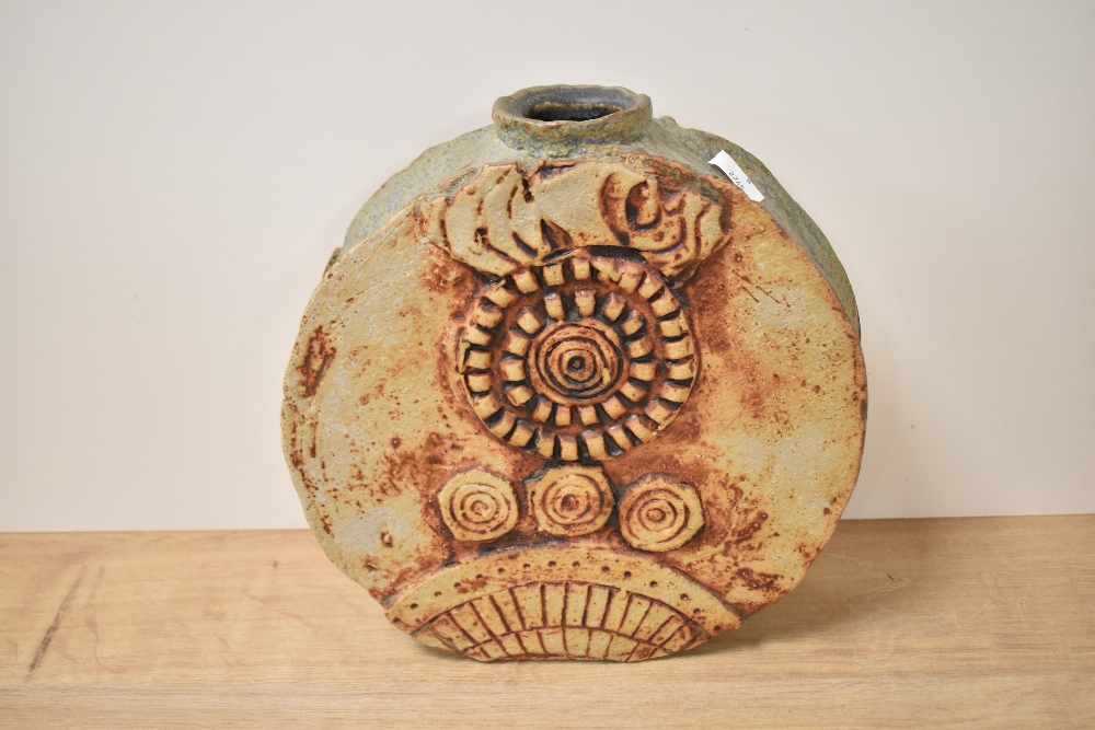 A mid-20th Century Troika style wheel vase, of brutalist design, measuring 26cm tall, showing some