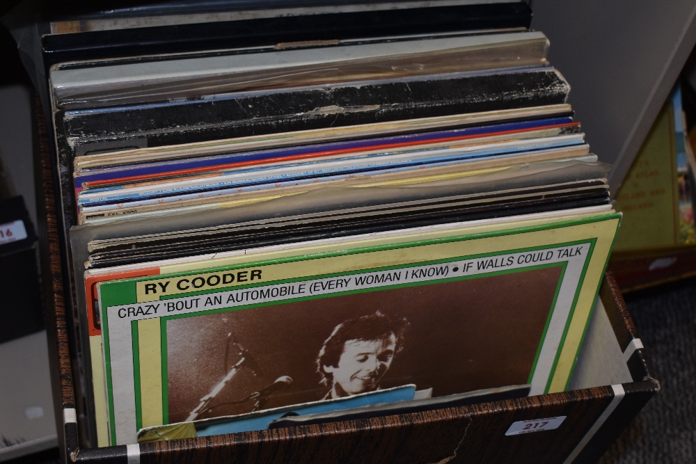 A carton of assorted LP records a range of genres including Supertramp, Leo Sayer and Ry Cooder