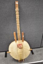 An African Kora string instrument.