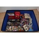 An assortment of costume jewellery including earrings of various design for pierced and non-