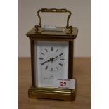 A Swiss made Matthew Norman carriage clock, having white enamel dial with black Roman numerals,