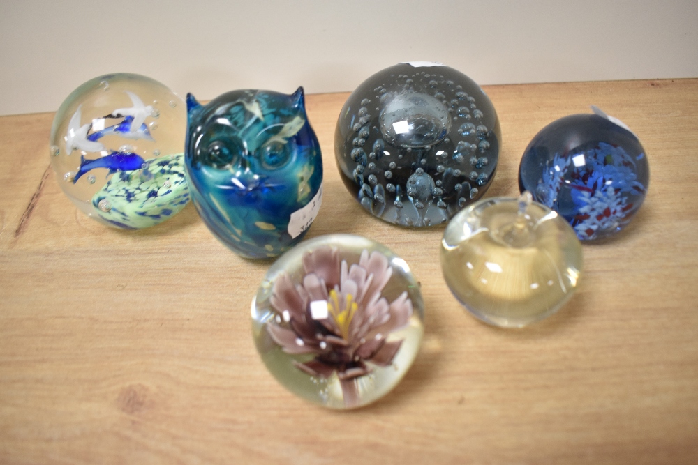 An assorted collection of 20th Century art glass paperweights and ornaments, to include a blue glass