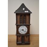 A vintage Gunter Kerzen wax candle clock tower.