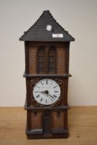 A vintage Gunter Kerzen wax candle clock tower.