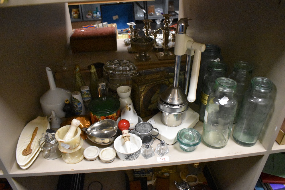 A quantity of vintage kitchenalia including Kilner jars, juice press, ceramic straining funnel,