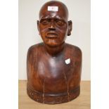 A 19th/20th Century African carved hardwood bust with inscription to the base, measuring 40cm tall