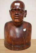 A 19th/20th Century African carved hardwood bust with inscription to the base, measuring 40cm tall