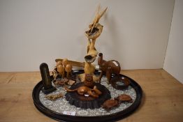 A selection of wooden items including two naturalistic burr studies, a carved mouse, an owl and a