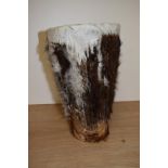 An African animal hide drum of tapering form, measuring 30cm high