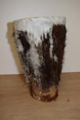 An African animal hide drum of tapering form, measuring 30cm high
